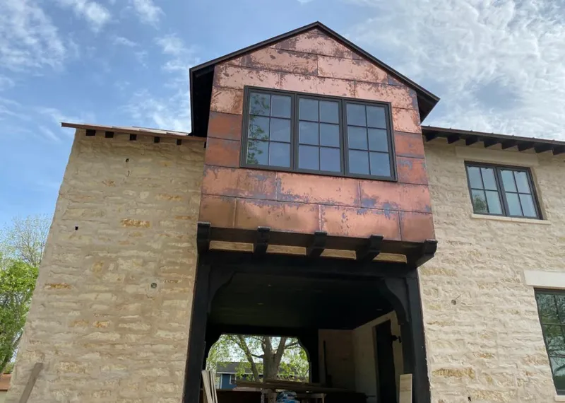Copper metal panel facade on a stone building for Metal Roof Coating in Walnut Park