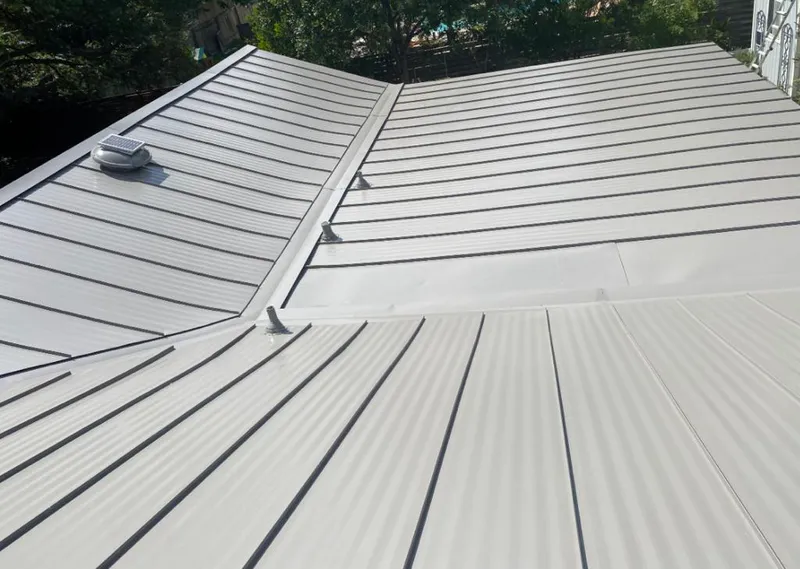 Solar attic fan installed on a metal roof for Roof Ventilation in Walnut Park